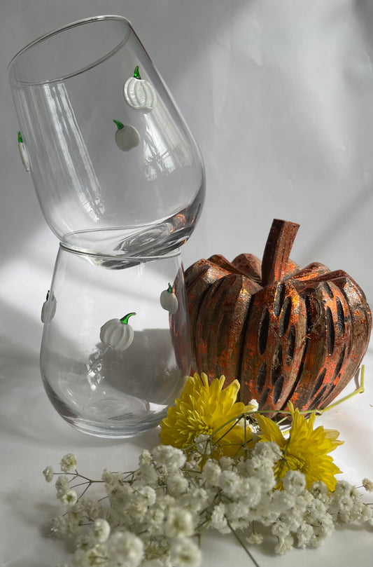 Clear glass stemware with decorative elements on a white background