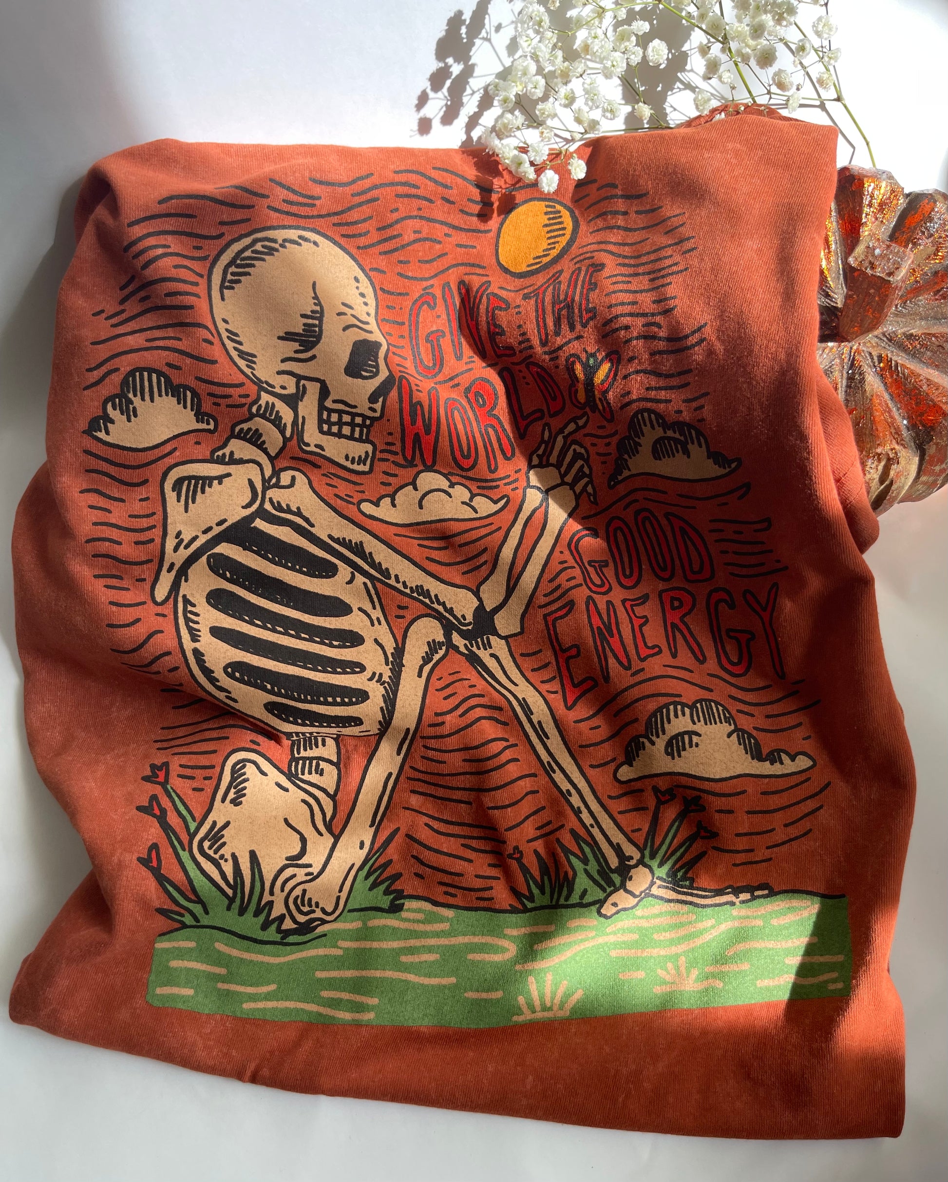 Brown bag with skeleton design and text on a white background